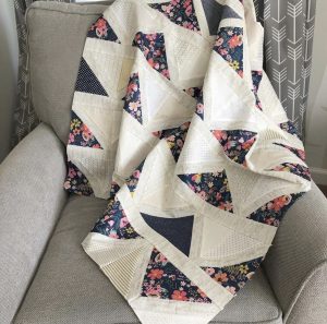 Cafe Tiles Quilt draped on couch