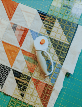 rotary cutter, fabric and ruler