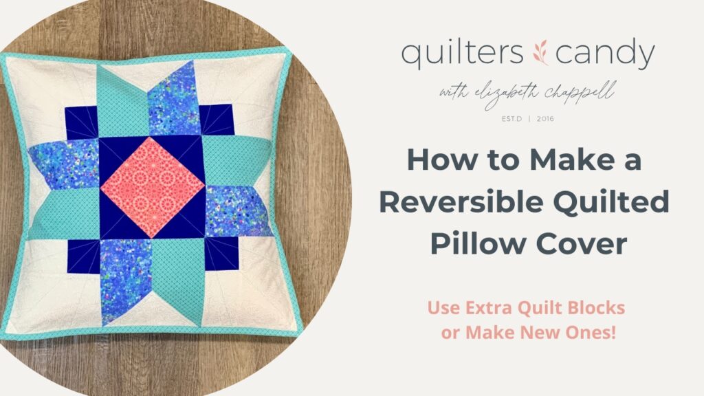 A reversible quilted pillow cover featuring a colorful quilt block design in blue, teal, and pink, bordered with light fabric and a turquoise binding. The pillow is placed on a wooden surface. The image includes text that reads "How to Make a Reversible Quilted Pillow Cover" with a subtitle, "Use Extra Quilt Blocks or Make New Ones!" under the Quilters Candy logo with Elizabeth Chappell’s name.