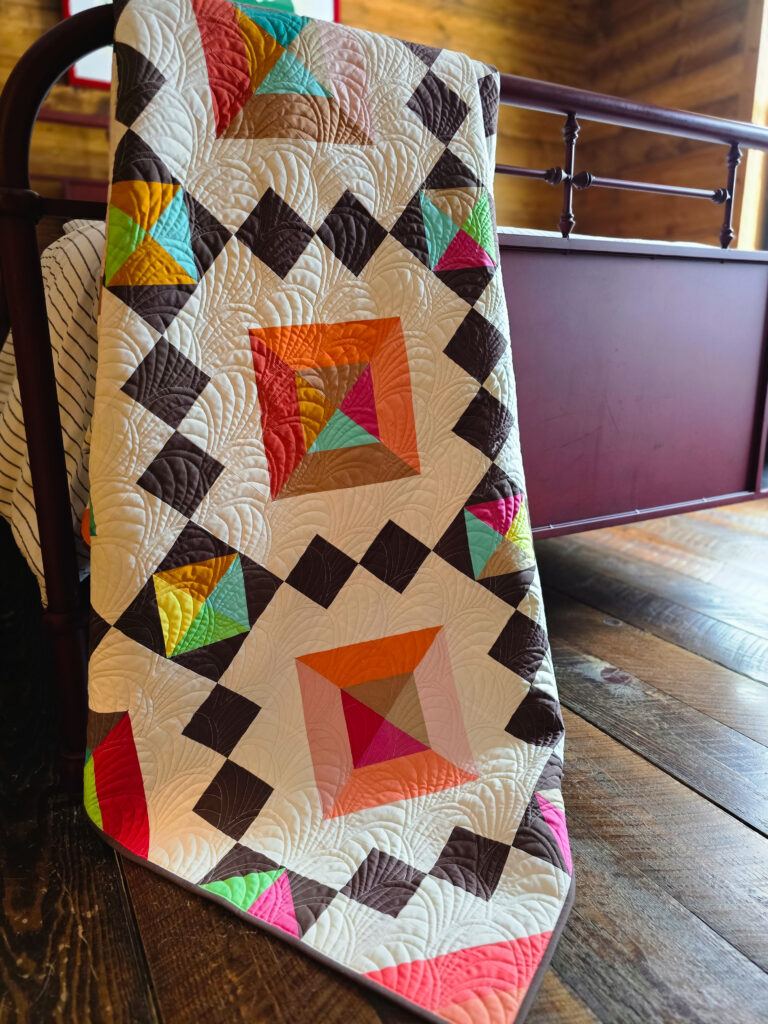 Stepping Stones quilt from Patchwork Companion book quilted with Behold pantograph, showing balanced allover quilting