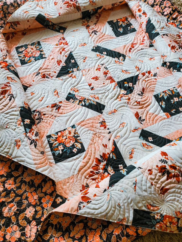 Twilight quilt with Mike’s Swoosh pantograph, showing medium-scale quilting for everyday quilt use