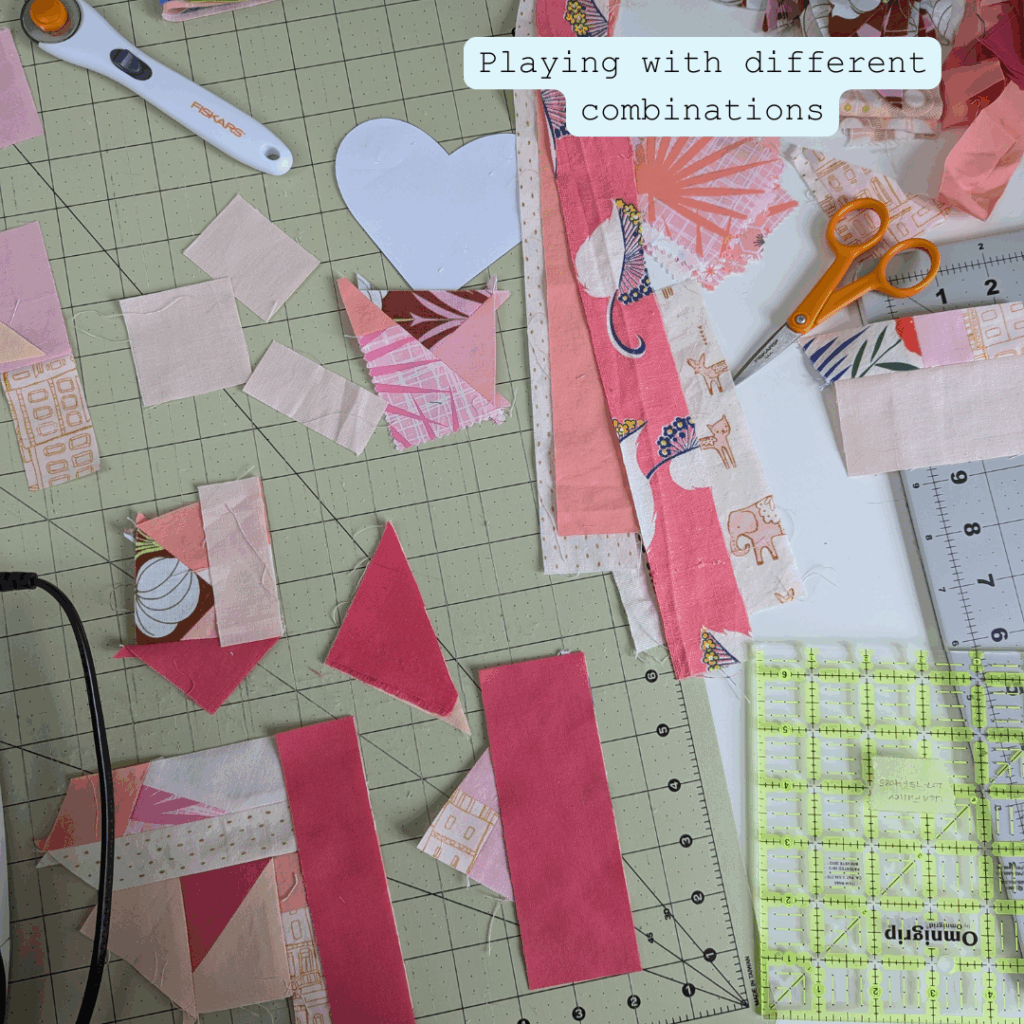 Fabric scraps arranged and ready to be chain pieced for a quilted heart