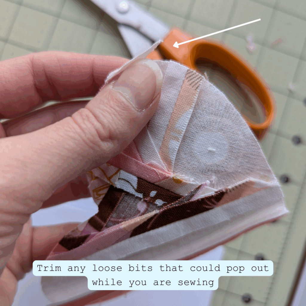 Trimming loose fabric edges from a quilted fabric heart