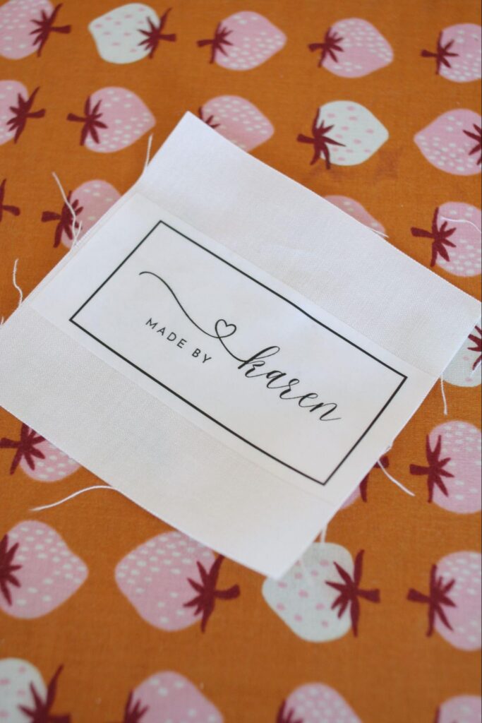 iron-on quilt label transfer applied to fabric before sewing onto quilt