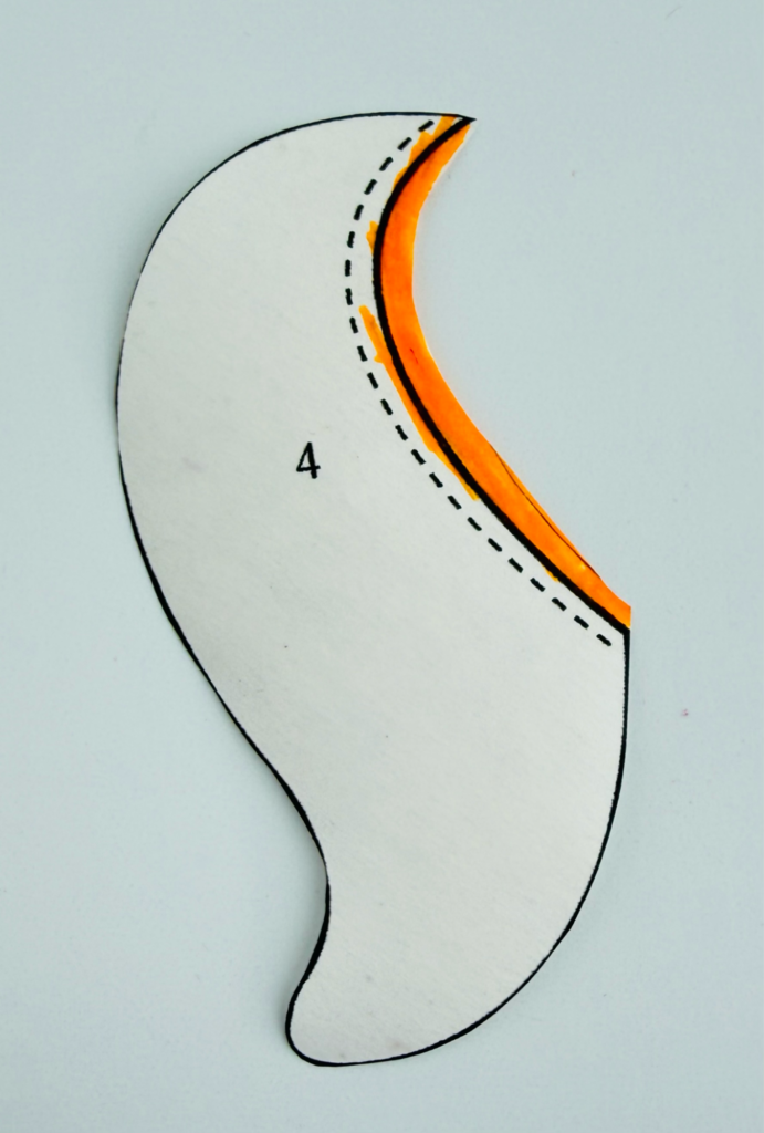 Appliqué template showing the dashed line that indicates fabric extending beneath an overlapping shape.