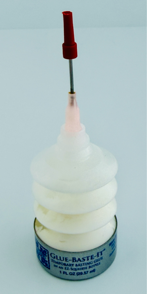 Roxanne’s Glue Baste-It bottle used to hold turned appliqué edges in place before stitching.