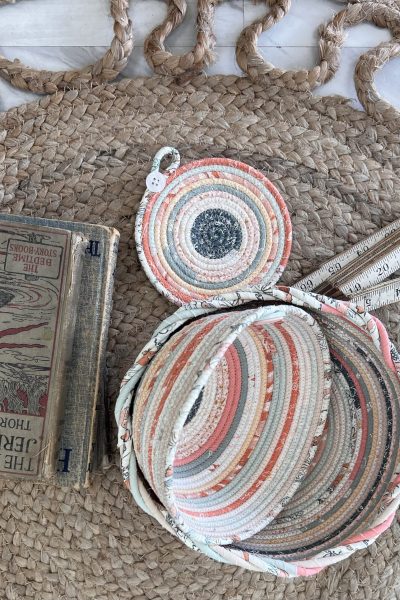 Fabric Pottery Bowl on a jute rug with a ruler and books